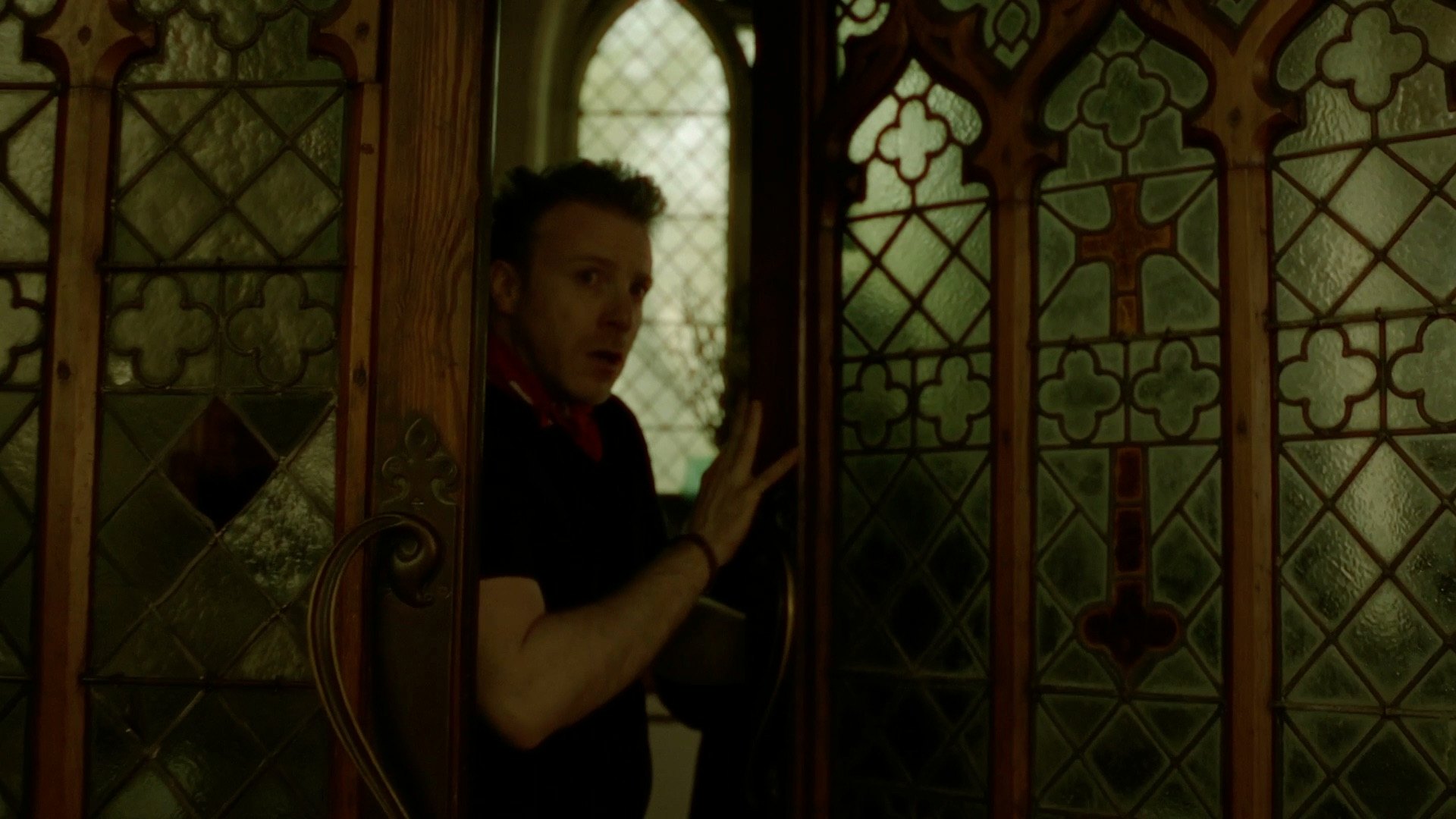 Cult Break — figure behind stained-glass window