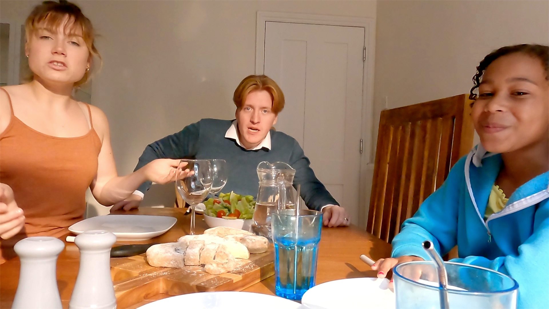 Memory-OS — three at dinner table