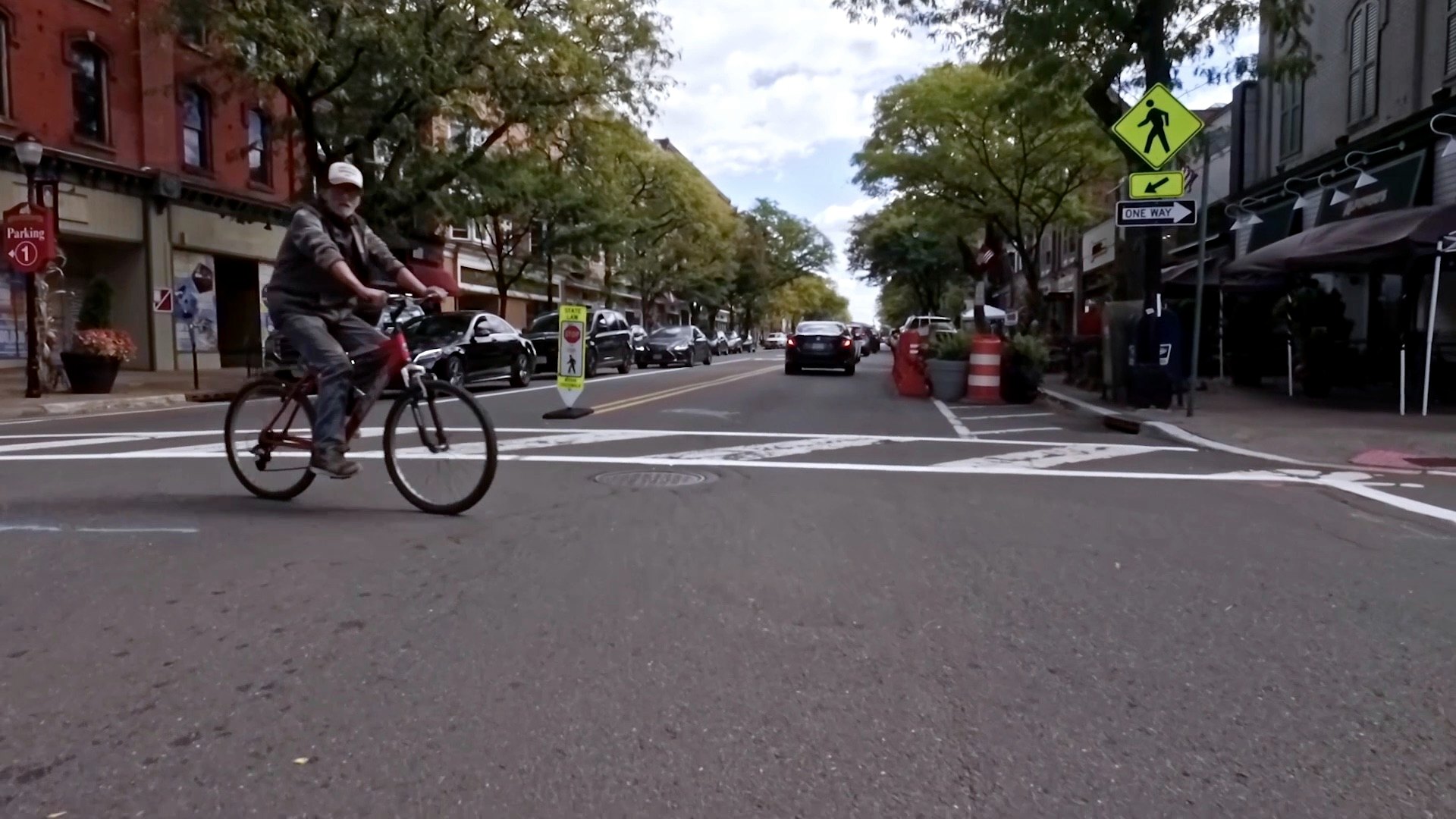Street scene, cyclist mid-frame, low angle